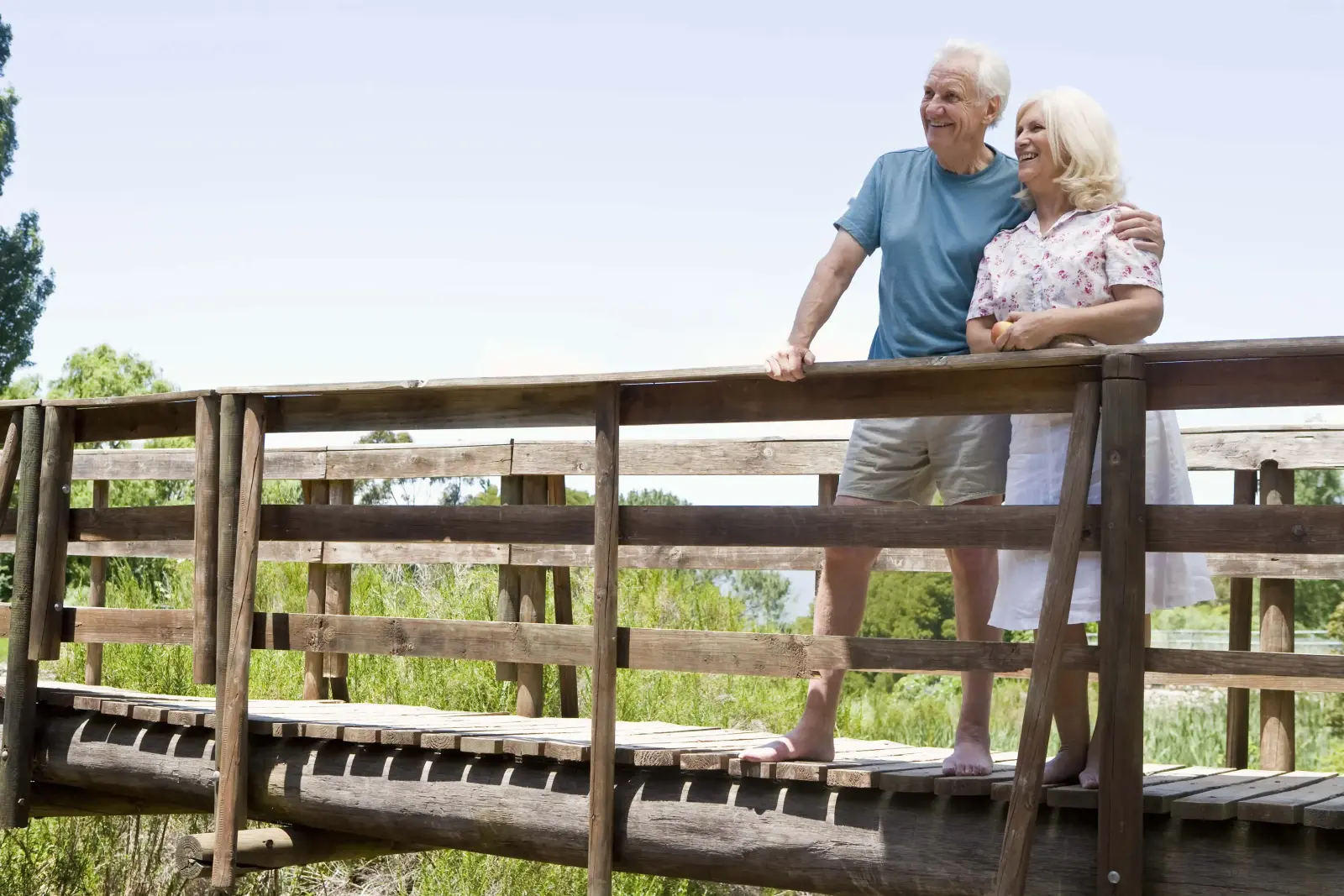 Senior couple standing on trail and looking in the distance